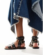 Fiji leather studded flat sandals in black